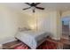 Bedroom with a ceiling fan, bed, and closet at 17851 W Calavar Rd, Surprise, AZ 85388