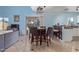 Cozy dining area with seating for four, adjacent to the kitchen and overlooking the backyard at 17851 W Calavar Rd, Surprise, AZ 85388