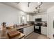Modern kitchen with granite countertops, white cabinetry, and stainless-steel appliances at 17851 W Calavar Rd, Surprise, AZ 85388