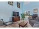 Inviting living room with vaulted ceiling, comfortable seating, and a cozy atmosphere at 17851 W Calavar Rd, Surprise, AZ 85388