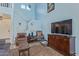 Comfortable living area with a staircase, television, and cozy seating at 17851 W Calavar Rd, Surprise, AZ 85388
