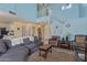 Bright, open-concept living room with a staircase, and comfortable seating at 17851 W Calavar Rd, Surprise, AZ 85388