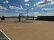 Community amenity featuring an outdoor basketball court with a gray, blue, and tan surface and blue sky at 18090 W Creedance Blvd, Surprise, AZ 85387