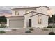 Inviting two-story stucco home featuring a clay tile roof, two-car garage, and desert landscaping at 18090 W Creedance Blvd, Surprise, AZ 85387