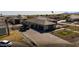 Expansive aerial view of the property highlighting the estate, a long paved driveway, and well-manicured landscaping at 18125 W Montebello Ct # 67, Litchfield Park, AZ 85340