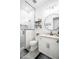 Modern bathroom featuring a glass enclosed shower, granite vanity, and round mirror for a sleek and stylish space at 18125 W Montebello Ct # 67, Litchfield Park, AZ 85340