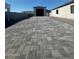 Long paved driveway leading to the garages with a modern curb appeal at 18125 W Montebello Ct # 67, Litchfield Park, AZ 85340