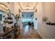 Inviting foyer with herringbone wood floors, designer lighting, and stylish decor at 18125 W Montebello Ct # 67, Litchfield Park, AZ 85340