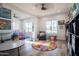 Bright playroom with hardwood floors, large windows, and plenty of open space at 18125 W Montebello Ct # 67, Litchfield Park, AZ 85340