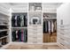 Organized walk-in closet with custom shelving and drawers for optimal storage at 18125 W Montebello Ct # 67, Litchfield Park, AZ 85340