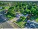 Aerial view of home with mature trees and an extra long driveway surrounded by a large yard at 1886 S 141St Pl, Gilbert, AZ 85295