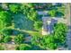 Aerial view of a home with a large yard, mature trees, and a well-maintained lawn at 1886 S 141St Pl, Gilbert, AZ 85295