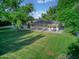 Large backyard with a patio and lawn at 1886 S 141St Pl, Gilbert, AZ 85295