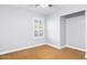 Minimal bedroom with large window, neutral walls, and carpeted floors at 1886 S 141St Pl, Gilbert, AZ 85295