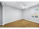 Bedroom features a ceiling fan and neutral walls at 1886 S 141St Pl, Gilbert, AZ 85295