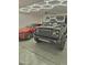 Well-lit garage showcasing two luxury cars at 1886 S 141St Pl, Gilbert, AZ 85295