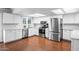 Bright kitchen features white cabinets, stainless steel appliances, and ample counter space for meal preparation at 1886 S 141St Pl, Gilbert, AZ 85295