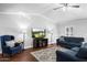 Inviting living room with high ceilings, hardwood floors, and stylish furniture, offering a comfortable gathering space at 1886 S 141St Pl, Gilbert, AZ 85295