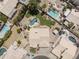 Aerial view showcases the backyard with a pool and spa, along with neighboring properties at 19010 N 35Th Way, Phoenix, AZ 85050