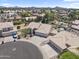 Overhead view displays a home with a three-car garage, surrounded by beautifully landscaped yards in a suburban neighborhood at 19010 N 35Th Way, Phoenix, AZ 85050