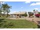 Spacious backyard featuring a pool, lush landscaping, and grass at 19010 N 35Th Way, Phoenix, AZ 85050
