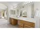Bright bathroom with dual sinks, large mirrors, and tile flooring at 19010 N 35Th Way, Phoenix, AZ 85050