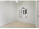 Bright bedroom with neutral carpet, and a large window with wooden shutters at 19010 N 35Th Way, Phoenix, AZ 85050
