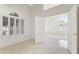 Bright bedroom featuring neutral carpet, plantation shutters and an open doorway at 19010 N 35Th Way, Phoenix, AZ 85050