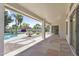 Spacious covered patio with tiled flooring offering seamless indoor-outdoor living and backyard views at 19010 N 35Th Way, Phoenix, AZ 85050