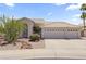 Charming home exterior featuring well-maintained landscaping and a spacious three-car garage at 19010 N 35Th Way, Phoenix, AZ 85050
