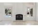Living room featuring a white fireplace and scenic views of the pool at 19010 N 35Th Way, Phoenix, AZ 85050