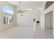 Bright living room featuring a chandelier, tiled entryway, and large windows at 19010 N 35Th Way, Phoenix, AZ 85050