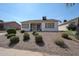 Private backyard offers a covered patio with seating and mature low maintenance landscaping at 1920 E Westchester Dr, Chandler, AZ 85249