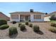 View of the rear exterior, a covered patio, desert landscaping, and a clear blue sky at 1920 E Westchester Dr, Chandler, AZ 85249