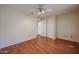Spacious bedroom with a ceiling fan and a closet with modern doors at 1920 E Westchester Dr, Chandler, AZ 85249