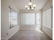 Inviting dining area featuring neutral walls, tile floors, and abundant natural light from large windows at 1920 E Westchester Dr, Chandler, AZ 85249