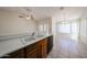 Bright kitchen featuring a double sink, tile flooring, and natural light from the nearby windows at 1920 E Westchester Dr, Chandler, AZ 85249