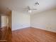 Large living room with wood-look flooring, ceiling fan, and neutral walls offers a comfortable atmosphere at 1920 E Westchester Dr, Chandler, AZ 85249