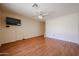Inviting living room with wood-look flooring, a ceiling fan, and neutral walls at 1920 E Westchester Dr, Chandler, AZ 85249