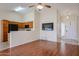 Inviting living room features hardwood floors, a vaulted ceiling with fan and adjoins the kitchen at 1920 E Westchester Dr, Chandler, AZ 85249