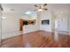 Inviting living room features hardwood floors, a vaulted ceiling with fan and adjoins the kitchen at 1920 E Westchester Dr, Chandler, AZ 85249