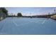 Community tennis courts with blue surface, fencing and mature landscaping at 1920 E Westchester Dr, Chandler, AZ 85249