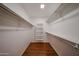 Spacious walk-in closet with wood flooring and built-in shelving for organized storage at 1920 E Westchester Dr, Chandler, AZ 85249