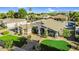 Aerial view of the single-Gathering home featuring desert landscaping and a beautiful mountain backdrop at 19903 E Augustus Ave, Queen Creek, AZ 85142