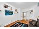 Bedroom features wood-look floors, a large closet, and a mounted television at 19903 E Augustus Ave, Queen Creek, AZ 85142