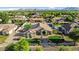 Inviting home featuring well-manicured lawns, mature trees, and excellent curb appeal in a well-maintained neighborhood at 19903 E Augustus Ave, Queen Creek, AZ 85142