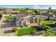 Beautiful home with lush green lawn and tasteful landscaping in a desirable neighborhood with mountain views at 19903 E Augustus Ave, Queen Creek, AZ 85142