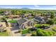 Desirable home nestled in a community, boasting lush landscaping, mature trees, and charming curb appeal at 19903 E Augustus Ave, Queen Creek, AZ 85142