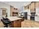 Expansive kitchen featuring a large island, stainless steel appliances, and an open layout at 19903 E Augustus Ave, Queen Creek, AZ 85142