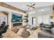 Inviting living room with a fireplace, modern decor, and ample natural light at 19903 E Augustus Ave, Queen Creek, AZ 85142
